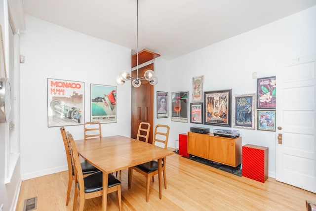 4805 S Langley Ave, Chicago, IL 60615 - dining area featuring light wood-style floors and baseboards