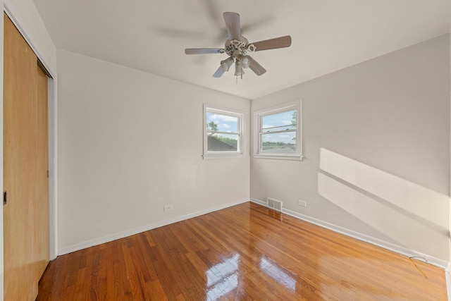 4537 Fishermans Ter, Lyons, IL 60534 - unfurnished bedroom with wood finished floors, a closet, and a ceiling fan