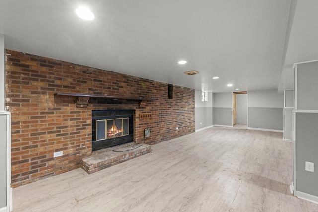 4537 Fishermans Ter, Lyons, IL 60534 - unfurnished living room with wood finished floors, a brick fireplace, and recessed lighting