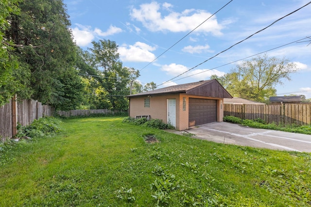 4537 Fishermans Ter, Lyons, IL 60534 - fenced yard featuring a detached garage and an outdoor structure