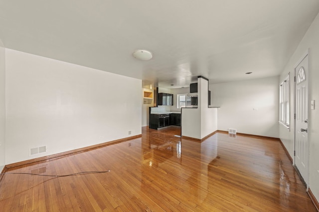 4537 Fishermans Ter, Lyons, IL 60534 - unfurnished living room featuring wood finished floors and baseboards