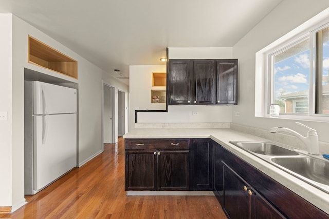 4537 Fishermans Ter, Lyons, IL 60534 - kitchen with freestanding refrigerator, open shelves, light wood finished floors, and light countertops