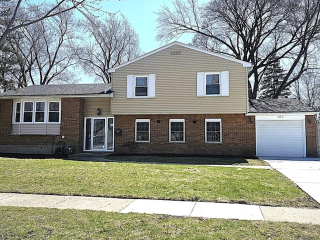1343 E Anderson Dr, Palatine, IL 60074 - split level home with brick siding, an attached garage, a front yard, and driveway