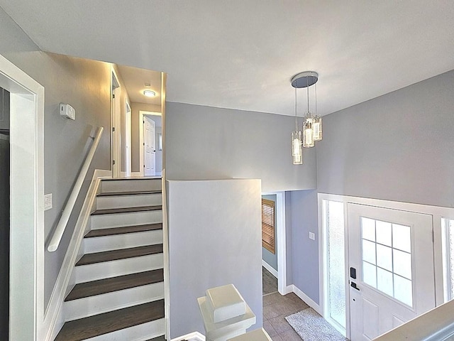 1343 E Anderson Dr, Palatine, IL 60074 - staircase with a chandelier, tile patterned floors, and baseboards