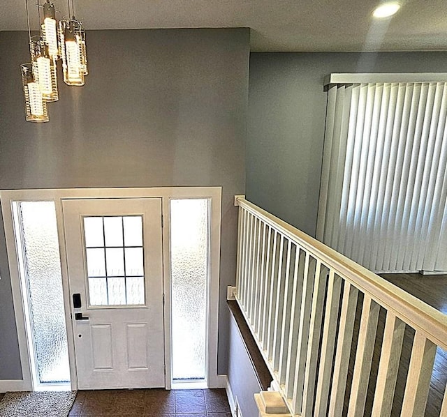 1343 E Anderson Dr, Palatine, IL 60074 - foyer featuring a chandelier and dark tile patterned floors