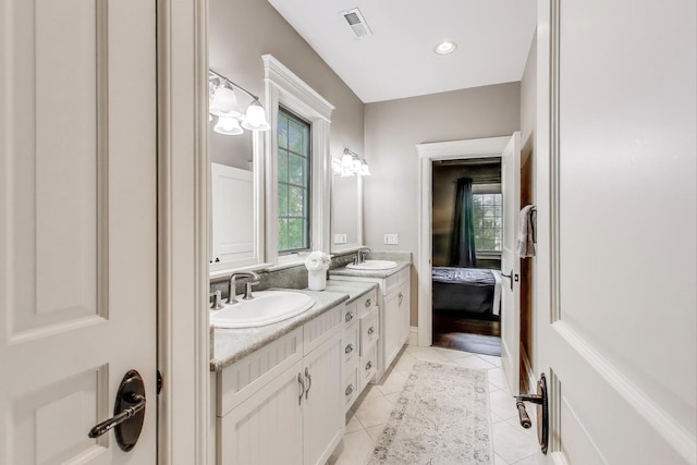 724 Becker Rd, Glenview, IL 60025 - ensuite bathroom featuring double vanity, plenty of natural light, and tile patterned floors