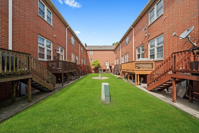 6235 S Knox Ave Unit K, Chicago, IL 60629 - view of home's community with stairs, a wooden deck, and a lawn