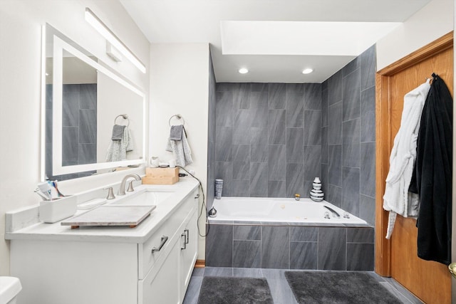 6235 S Knox Ave Unit K, Chicago, IL 60629 - full bath with vanity, a relaxing tiled tub, toilet, recessed lighting, and tile patterned flooring