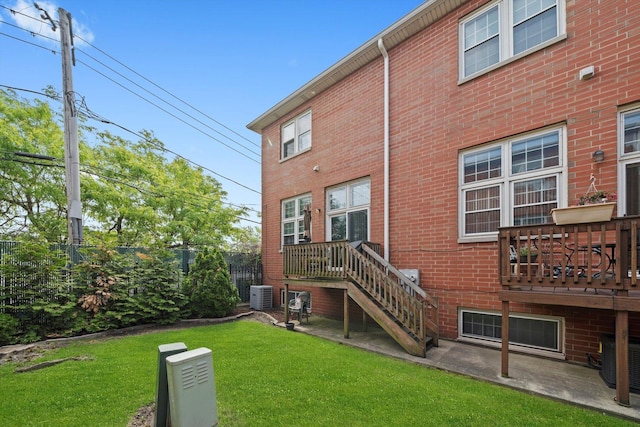 6235 S Knox Ave Unit K, Chicago, IL 60629 - back of property featuring central AC unit, brick siding, and a wooden deck