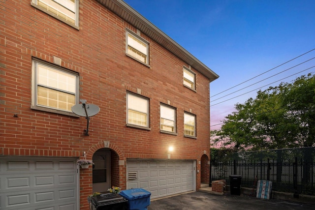6235 S Knox Ave Unit K, Chicago, IL 60629 - view of front of house with a garage, brick siding, and driveway