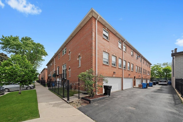 6235 S Knox Ave Unit K, Chicago, IL 60629 - view of property featuring driveway and a garage