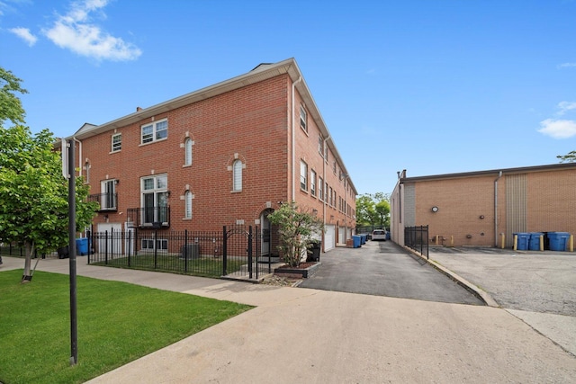 6235 S Knox Ave Unit K, Chicago, IL 60629 - view of building exterior with driveway and an attached garage