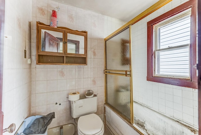 2227 W 21st St, Chicago, IL 60608 - full bathroom featuring toilet, tile walls, and shower / bath combination with glass door