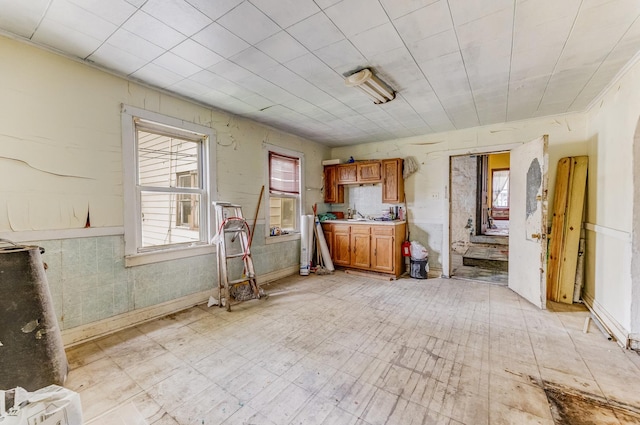 2227 W 21st St, Chicago, IL 60608 - kitchen with brown cabinets, light countertops, and a sink