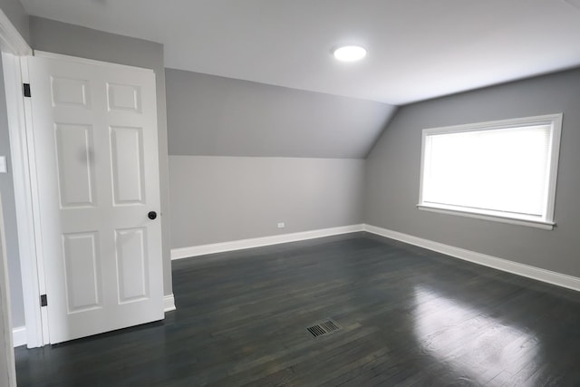 10817 S Eberhart Ave, Chicago, IL 60628 - bonus room featuring baseboards, lofted ceiling, and dark wood-type flooring