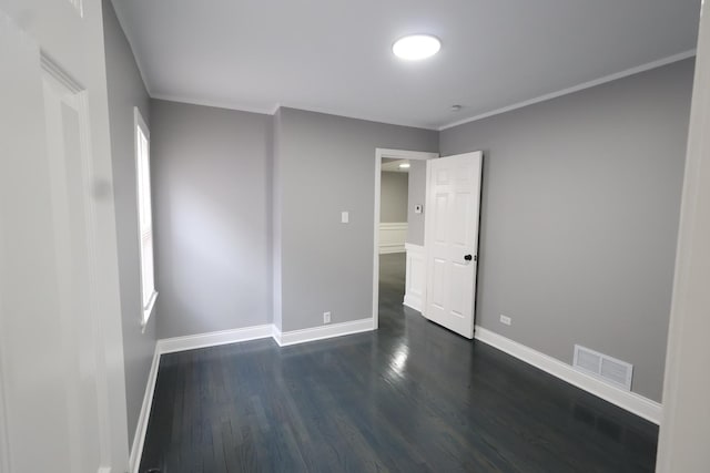 10817 S Eberhart Ave, Chicago, IL 60628 - unfurnished room with baseboards, dark wood-style floors, and crown molding