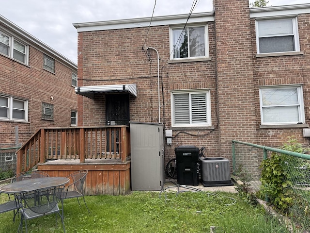 11247 S S Ave L, Chicago, IL 60617 - rear view of property with central AC, brick siding, and a wooden deck