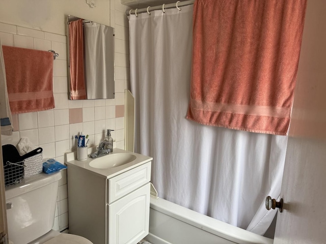 11247 S S Ave L, Chicago, IL 60617 - full bathroom featuring backsplash, vanity, toilet, shower / bath combo with shower curtain, and tile walls