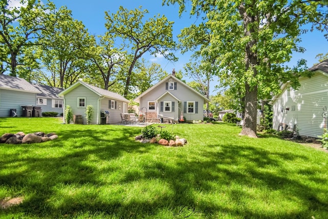 3019 Crescent Ave, Mchenry, IL 60050 - back of property featuring a lawn and a chimney