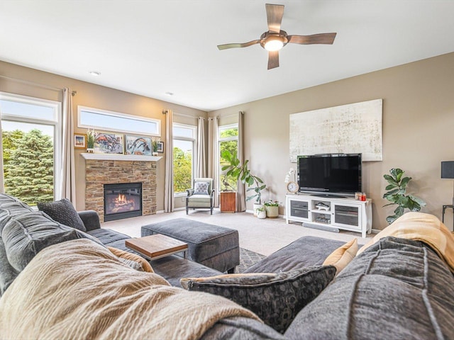 11546 Ridgecrest Dr, Roscoe, IL 61073 - living area featuring carpet, ceiling fan, and a stone fireplace