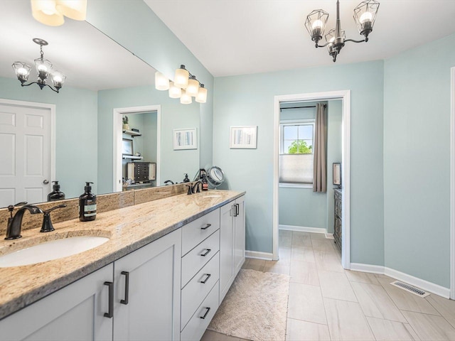 11546 Ridgecrest Dr, Roscoe, IL 61073 - bathroom with a chandelier and double vanity
