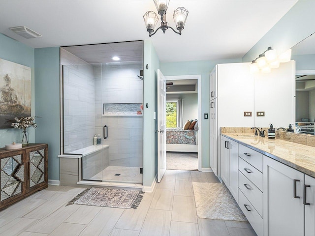 11546 Ridgecrest Dr, Roscoe, IL 61073 - full bathroom with ensuite bathroom, vanity, a stall shower, and a chandelier