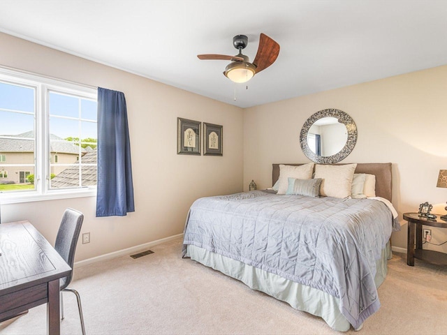 11546 Ridgecrest Dr, Roscoe, IL 61073 - bedroom with light carpet, ceiling fan, and a desk