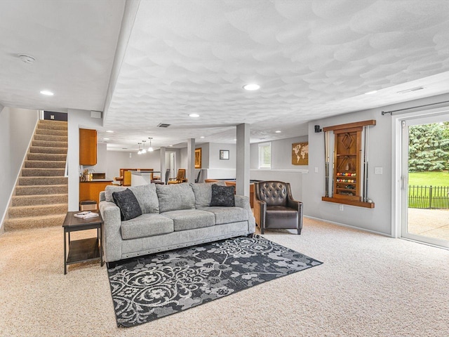 11546 Ridgecrest Dr, Roscoe, IL 61073 - carpeted living room with bar, stairway, recessed lighting, and plenty of natural light