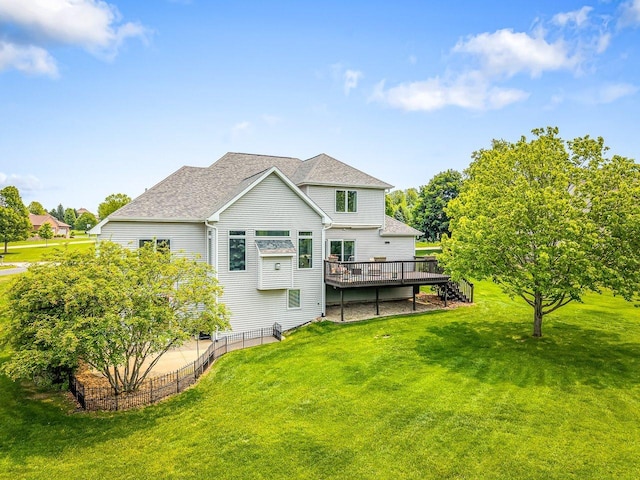 11546 Ridgecrest Dr, Roscoe, IL 61073 - back of property with a deck and roof with shingles