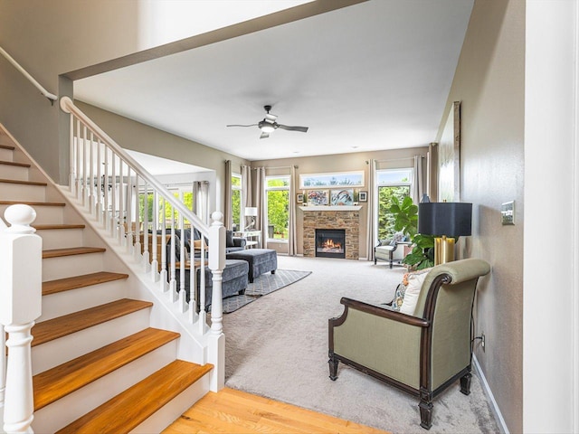 11546 Ridgecrest Dr, Roscoe, IL 61073 - living room with a ceiling fan, plenty of natural light, stairs, and a fireplace