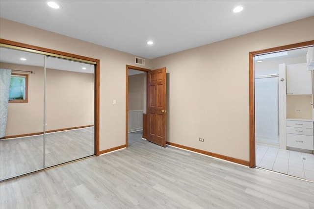 9 Craig Ter, Lake Zurich, IL 60047 - unfurnished bedroom featuring light wood-type flooring, a closet, recessed lighting, and ensuite bath
