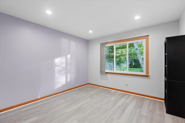 9 Craig Ter, Lake Zurich, IL 60047 - empty room with wood finished floors and recessed lighting
