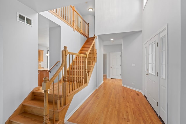 7N001 Ridge Line Rd, Saint Charles, IL 60175 - entrance foyer with a high ceiling, stairway, light wood-type flooring, and recessed lighting