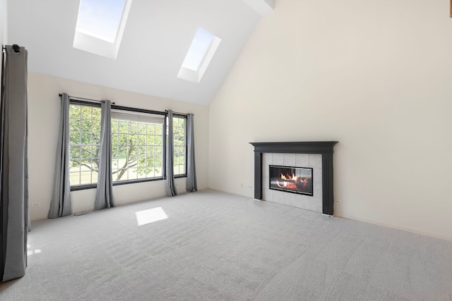 7N001 Ridge Line Rd, Saint Charles, IL 60175 - unfurnished living room featuring a skylight, high vaulted ceiling, a tiled fireplace, and carpet floors