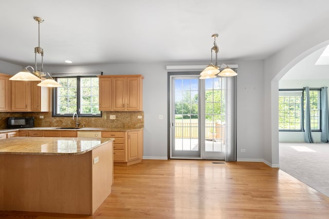 7N001 Ridge Line Rd, Saint Charles, IL 60175 - kitchen featuring black microwave, arched walkways, light wood-style flooring, and backsplash
