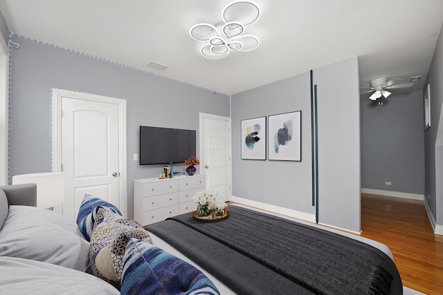 5151 W Fletcher St, Chicago, IL 60641 - bedroom featuring wood finished floors and baseboards