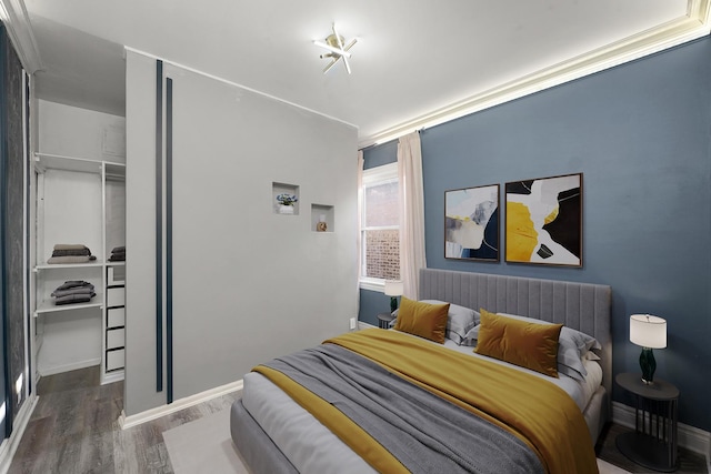 5151 W Fletcher St, Chicago, IL 60641 - bedroom with wood finished floors, a closet, and baseboards