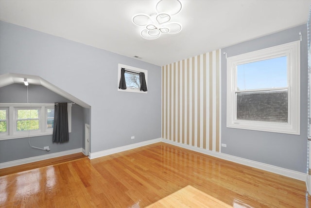 5151 W Fletcher St, Chicago, IL 60641 - unfurnished living room with light wood-style flooring and baseboards