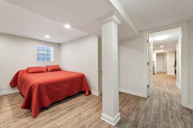 5151 W Fletcher St, Chicago, IL 60641 - bedroom with wood finished floors, baseboards, ornate columns, and recessed lighting