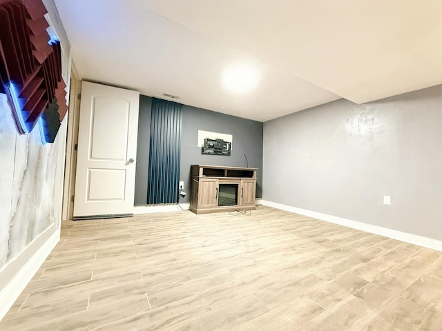 5151 W Fletcher St, Chicago, IL 60641 - finished basement with baseboards and light wood finished floors