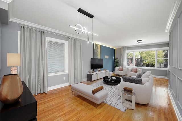 5151 W Fletcher St, Chicago, IL 60641 - living room with light wood finished floors, ornamental molding, and baseboards