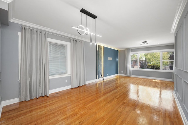 5151 W Fletcher St, Chicago, IL 60641 - unfurnished room with crown molding, light wood finished floors, and baseboards