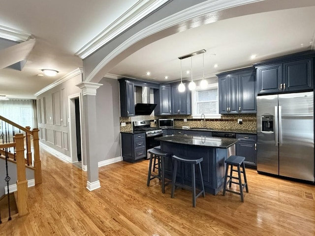 5151 W Fletcher St, Chicago, IL 60641 - kitchen featuring appliances with stainless steel finishes, a sink, ornamental molding, a kitchen breakfast bar, and backsplash