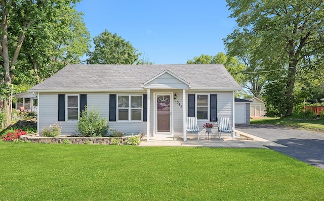 345 W Joe Orr Rd, Chicago Heights, IL 60411 - view of front of home featuring a front lawn and a shingled roof