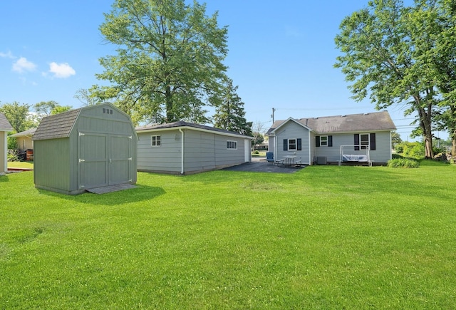 345 W Joe Orr Rd, Chicago Heights, IL 60411 - view of green lawn with a shed and a patio