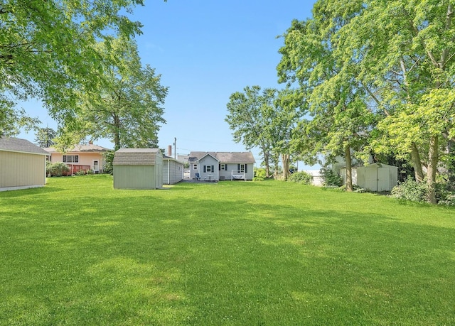 345 W Joe Orr Rd, Chicago Heights, IL 60411 - view of green lawn featuring a storage unit