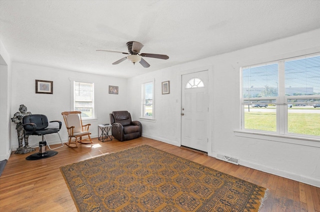 345 W Joe Orr Rd, Chicago Heights, IL 60411 - foyer with light wood-style floors, a ceiling fan, and a textured ceiling