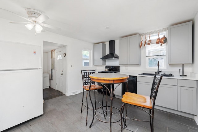 345 W Joe Orr Rd, Chicago Heights, IL 60411 - kitchen featuring black appliances, wall chimney exhaust hood, ceiling fan, gray cabinets, and light countertops