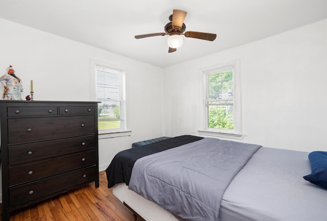 345 W Joe Orr Rd, Chicago Heights, IL 60411 - bedroom with multiple windows, wood finished floors, and a ceiling fan