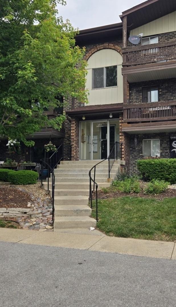 14015 James Dr Unit 523, Crestwood, IL 60418 - view of front of home with a balcony and brick siding